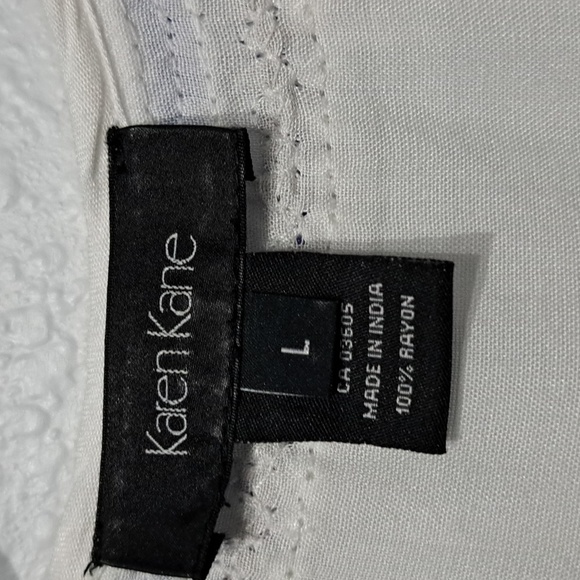 Karen Kane Beaded V-Neck Sleeveless Sharkbite Hem Tank Top - Picture 9 of 11